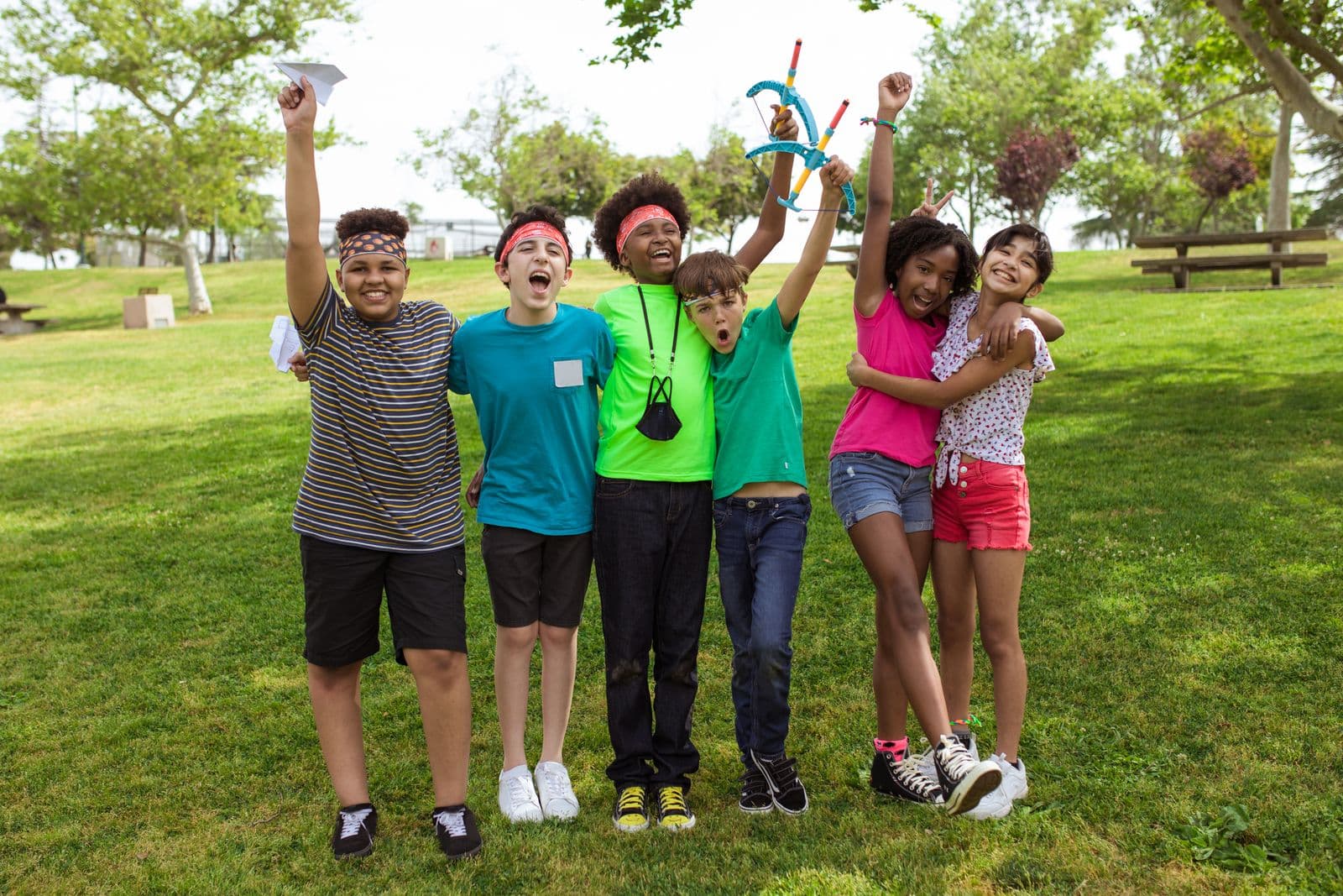 Children cheering together at a youth sports game